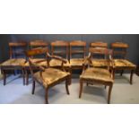 A set of eight Regency mahogany dining chairs including two carvers, each with bowed top rails and