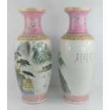 A pair of 20th century Chinese famille rose vases, of impressive size, each painted with a scene