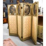 A late 19th / early 20th century French parcel gilt four fold screen. each panel with an oval glazed