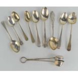 A silver tea strainer and nine silver teaspoons, Sheffield and Birmingham hallmarks, 5.1toz