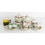 A miniature porcelain tea set, together with a Meissen leaf form dish, and coffee can with a