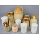 A group of stoneware apothecary jars and flagon