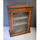 A 19th century walnut inlaid pier cabinet, with glazed doors and velvet lined shelves, 30 by 39 by