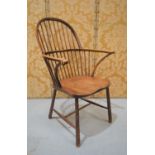 A 19th century windsor chair with spindle back, and stretchers on tapering cylindrical legs, 43 by