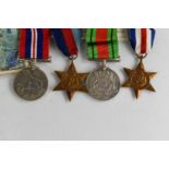A WWII medal group including Campaign stars, Defence medal and 1939-1945 medal, together with box to