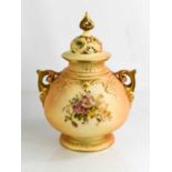 A Royal Worcester blush ivory vase, and cover with painted floral decoration and pierced and