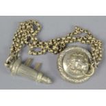 A Victorian lion headed cross belt whistle and chain