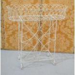 A cream painted wirework plant stand, 74 by 30 by 78cm high.