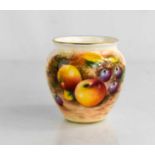 A Royal Worcester vase, painted with fruits and signed, 7cm.
