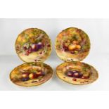 A set of four Royal Worcester plated by Horice Price, painted with fruit on a mossy ground, circa