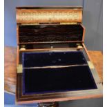 A fine Napoleon III brass bound and mother of pearl parquetry and kingwood writing slope, the hinged