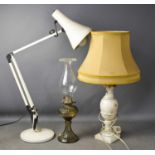 An anglepoise lamp, marble based table lamp and antique parafin lamp.