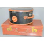 A vintage leather suitcase together with a vintage hat box with a White Star Line shipping label