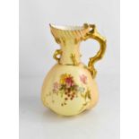 A Royal Worcester blush ivory jug with coral form gilded handle, painted with sprays of flowers,