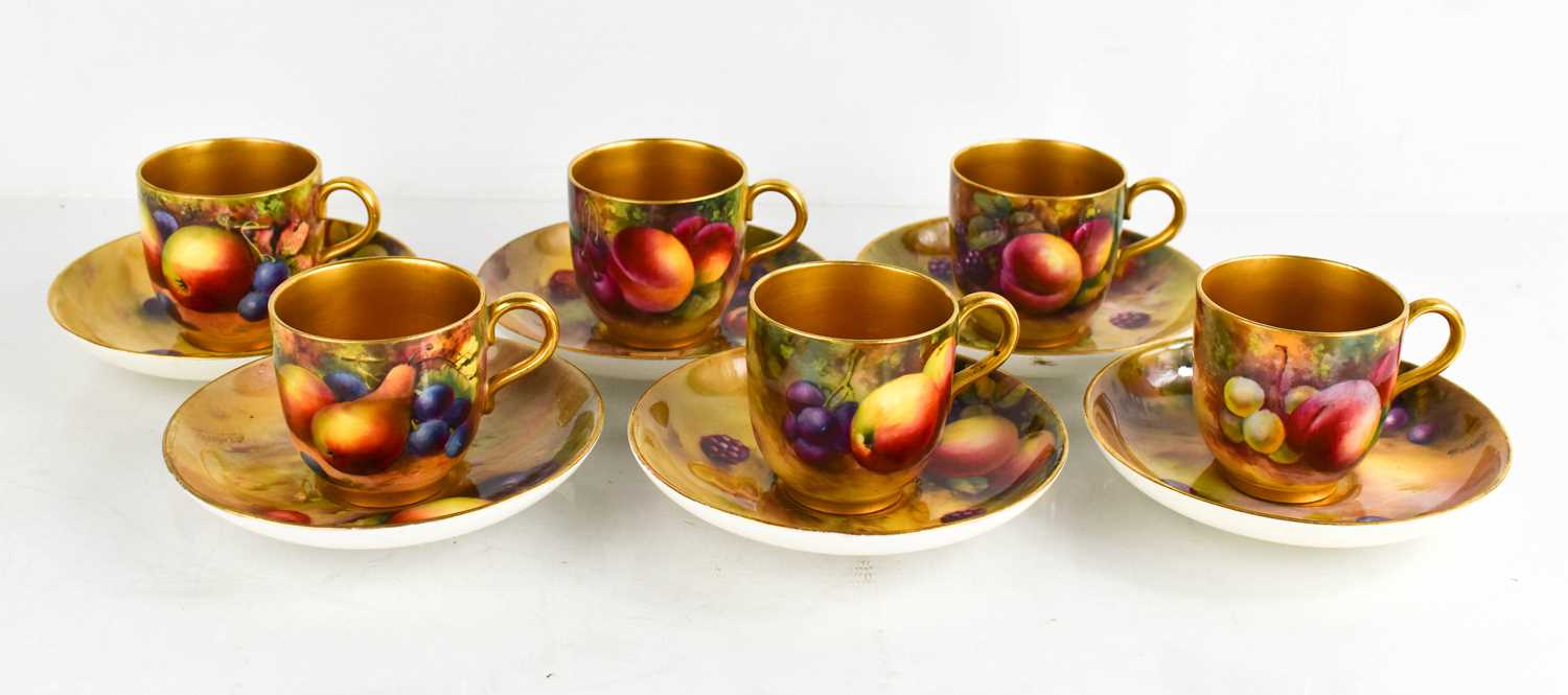 A set of six Royal Worcester cups and saucers, painted with fruit on mossy ground, by Everett,