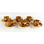 A set of six Royal Worcester cups and saucers, painted with fruit on mossy ground, by Everett,