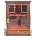 A Victorian mahogany glazed table top display cabinet, the glass astragal door enclosing interior