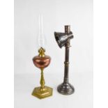 An antique brass and copper table lemp, toether with a steel candleholder with reflector cone 43cm