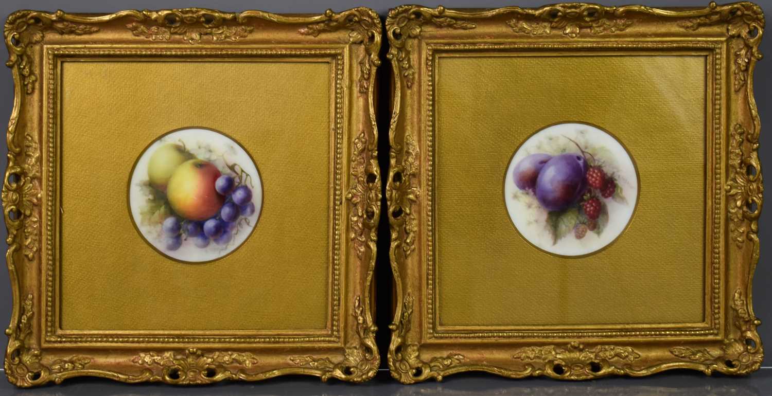 A pair of Royal Worcester porcelain plaques, by R. Seabright, both depicting fruit, 4 ins