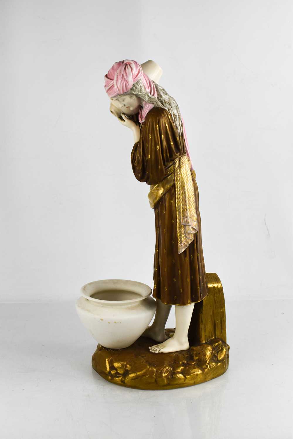 A late 19th century Royal Worcester model of an Eastern water carrier, modelled by James Hadley, - Image 2 of 3