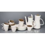 A Poole Pottery part coffee service in two tone brown and cream, comprising coffee pot, 25cm high,
