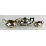 A George III three piece silver tea set comprising tea pot, sugar bowl and milk jug, by Robert &