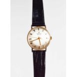 A Martin Revue 9ct gold cased wristwatch, manual wind, with silvered dial and black leather strap,