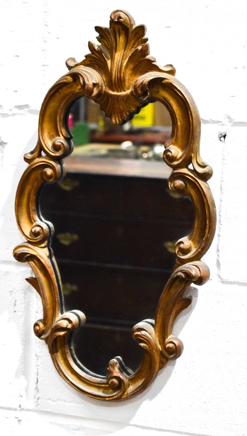 A small 19th century scroll work wall mirror with foliate crested top52cm high
