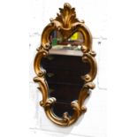 A small 19th century scroll work wall mirror with foliate crested top52cm high