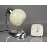 A Retro chrome table lamp with glass shade, together with a vintage Smiths alarm clock.