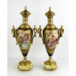 A pair of fine French porcelain and ormolu urns, the bodies painted with lovers by George