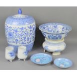 A group of Chinese blue and white pottery to include a large lidded jar, brush pots, and bowl,