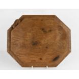 Robert Thompson 'Mouseman' oak octagonal bread board, with carved signature mouse, 12 by 10 ins.