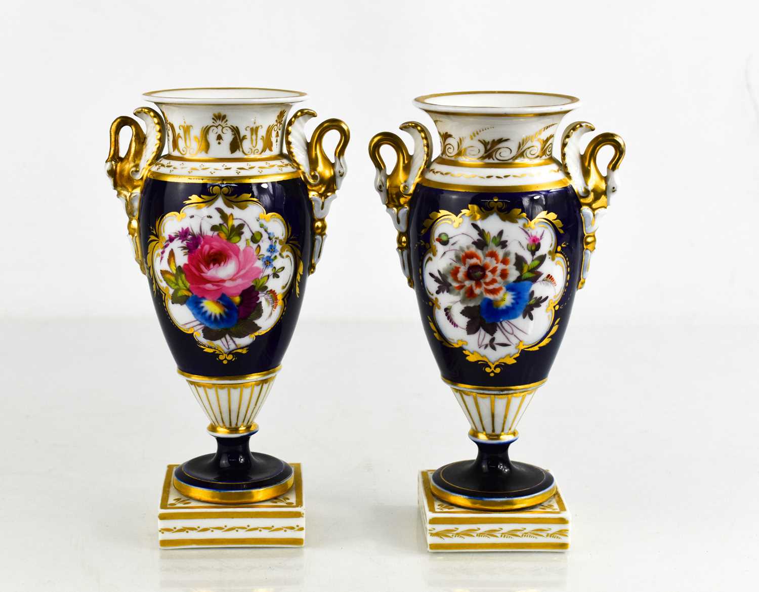 A pair of Chamberlain Royal Worcester pedestal vases, campana shape painted with flowers, cobalt