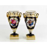 A pair of Chamberlain Royal Worcester pedestal vases, campana shape painted with flowers, cobalt