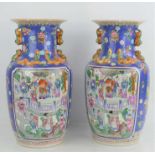 A pair of Chinese vases depicting Chinese court scenes with decorated borders to rim and base,