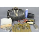 A vintage leathers doctors bag and equipment to include Arnold & Sons brass syringe, Bell &