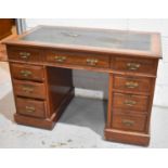 A Victorian mahogany pedestal desk with leather skiver and two pedestals with three drawers74cm by