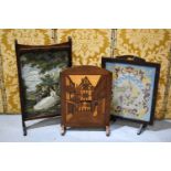 A pair of vintage firescreens, one a needlework tapestry example the other parquetry inlaid