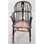 A pair of 19th century elm Windsor armchair, with hoop back pierced with spindles, bowed arm rail
