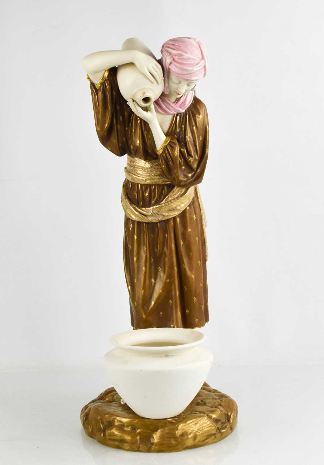 A late 19th century Royal Worcester model of an Eastern water carrier, modelled by James Hadley,