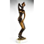 A large hardwood African carved figurine of a woman, 82cm high.