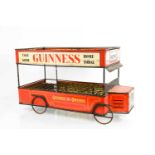 A vintage Guiness tin-plate Omnibus bottle crate, circa 1950, 39.5 by 21 by 27cm high.39.5 by 21