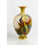 A Royal Worcester vase, decorated with a peacocks amidst trees, circa 1914, 7ins high.