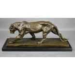 A bronze sculpture of a walking panther in the style of Rembrandt Bugatti, signed Bugatti to base