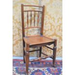 A 19th century oak country spindle back chair, with turned legs.
