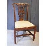 A George III Chippendale revival dining room chair, with carved mahogany back and drop in