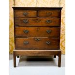 An 18th century oak chest on stand, comprising two over three long graduated drawers, 52 by 95 by