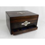 A Victorian coromandel dressing table box with mirrored interior, fitted with seven silver plated