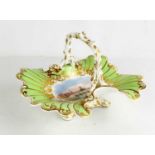 A Worcester Graingers porcelain basket, circa 1840, of leaf moulded form, with crabstock handle,